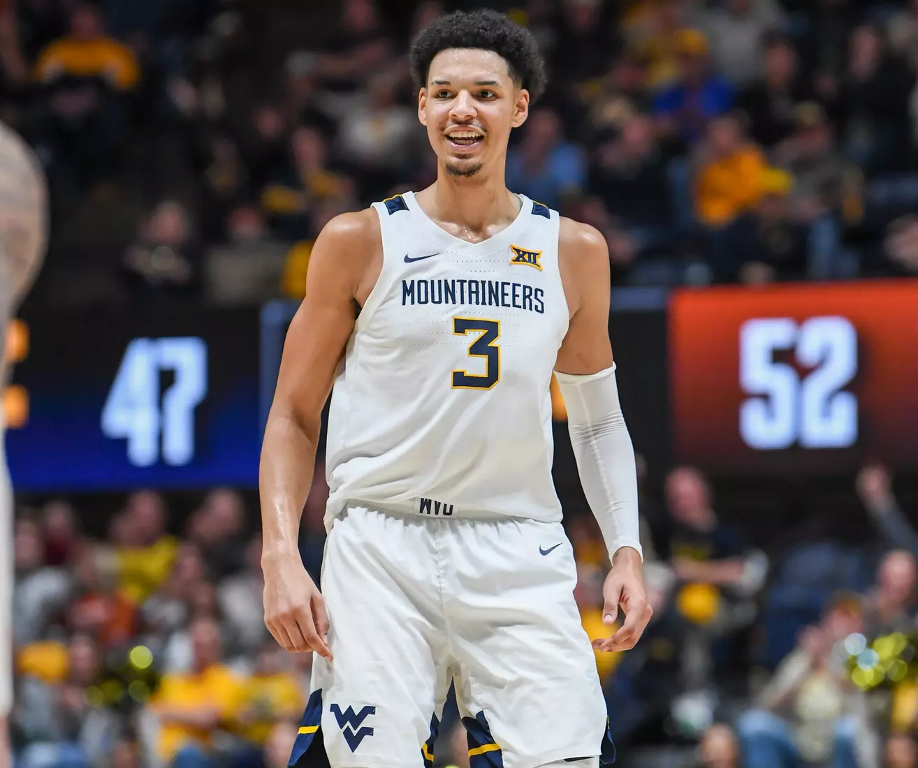 Tre Mitchell is all smiles after a three-pointer.
