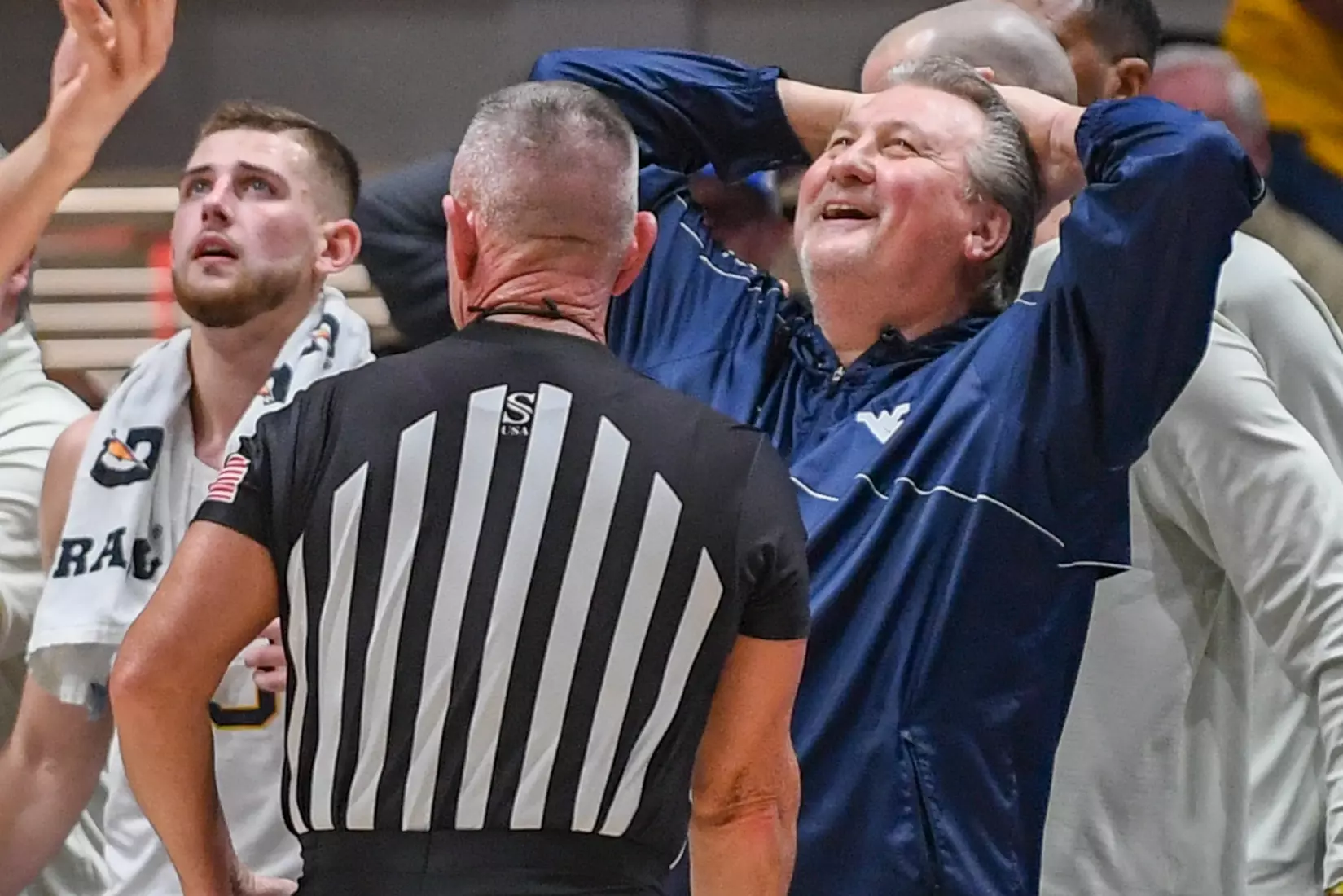 Bob Huggins is in disbelief from an official's call.