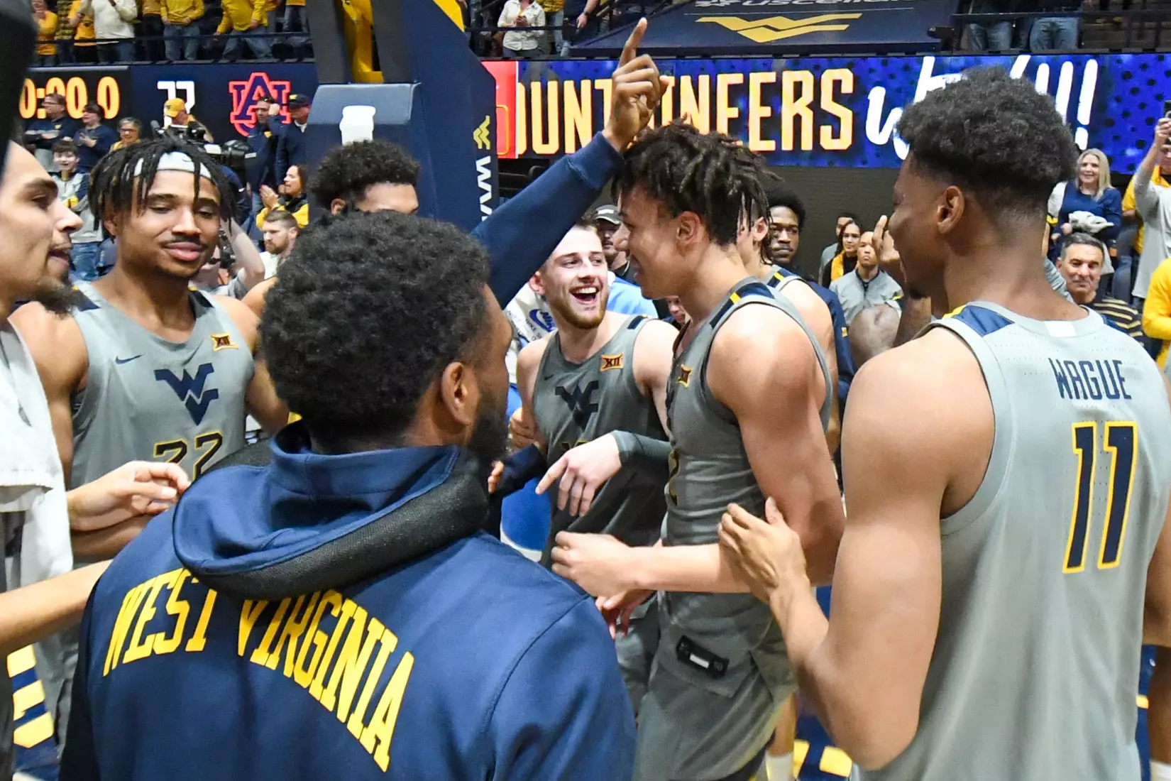 Erik Stevenson is mobbed by his teammates after scoring 31 points.