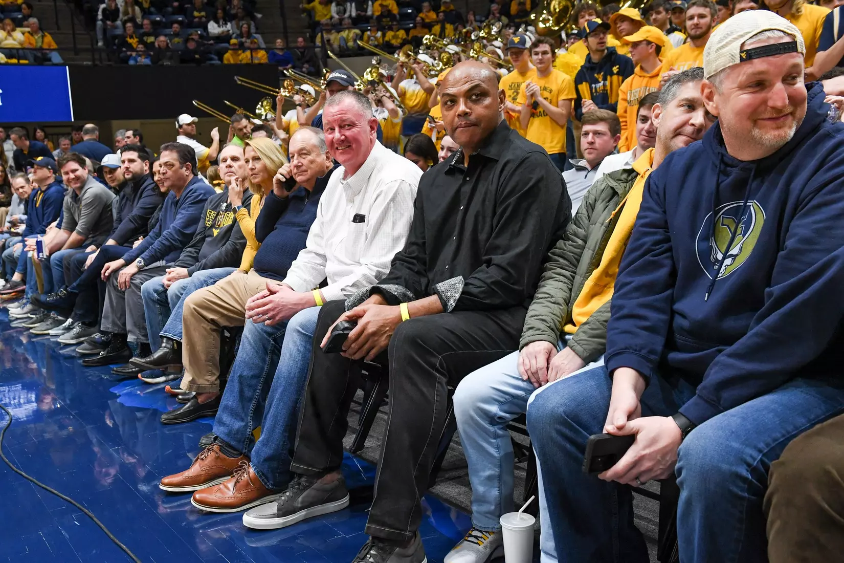 NBA great Charles Barkley sits courtside at the WVU Auburn game.
