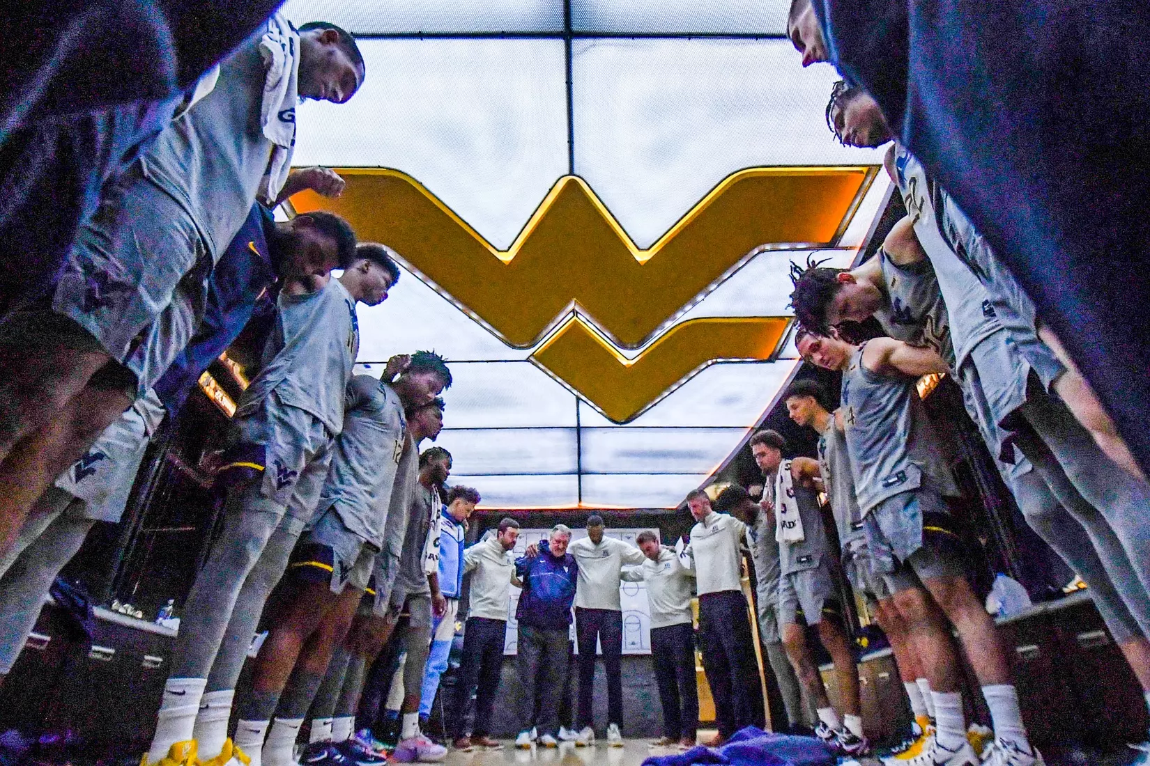 The Mountaineers celebrate the win over Auburn with the Lord's prayer.