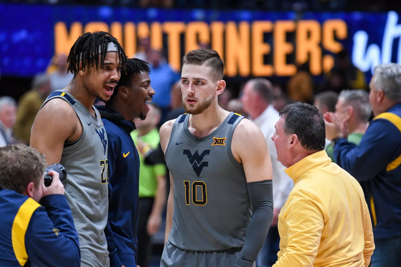 Erik Stevenson is congratulated by his teammates after scoring 31 points.