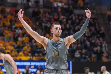 Erik Stevenson celebrates a three-pointer.