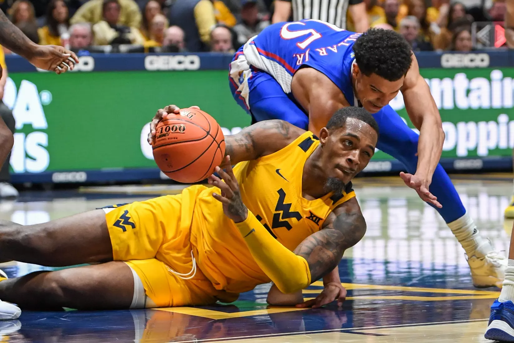Jimmy Bell Jr. passes after gathering the loose ball.