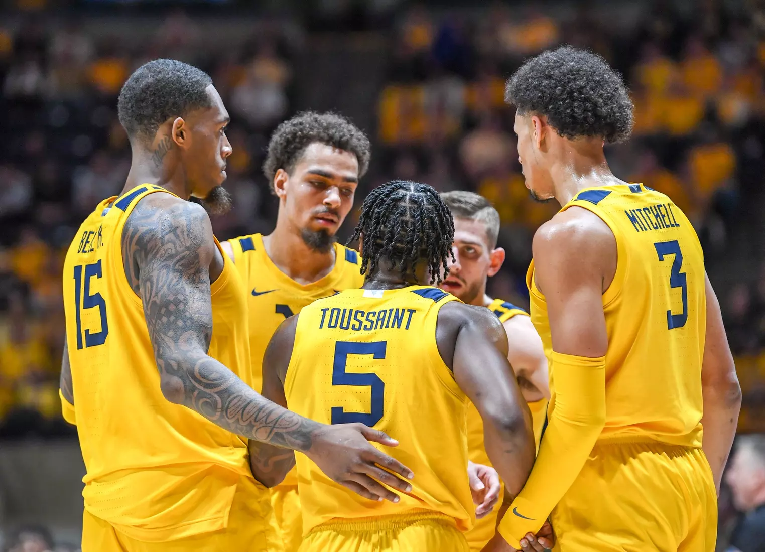 The Mountaineers huddle at the foul line.