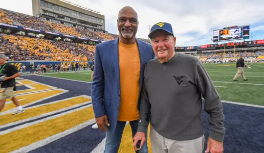 Darryl Talley and former Mountaineer coach Don Nehlen stop for a photo.