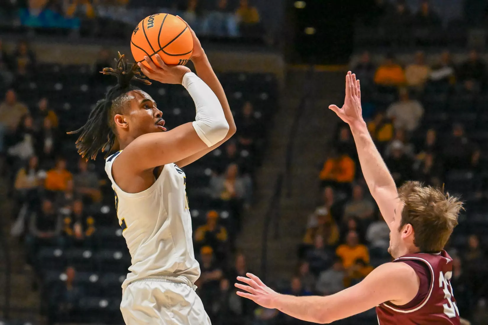 Josiah Harris shoots a three.