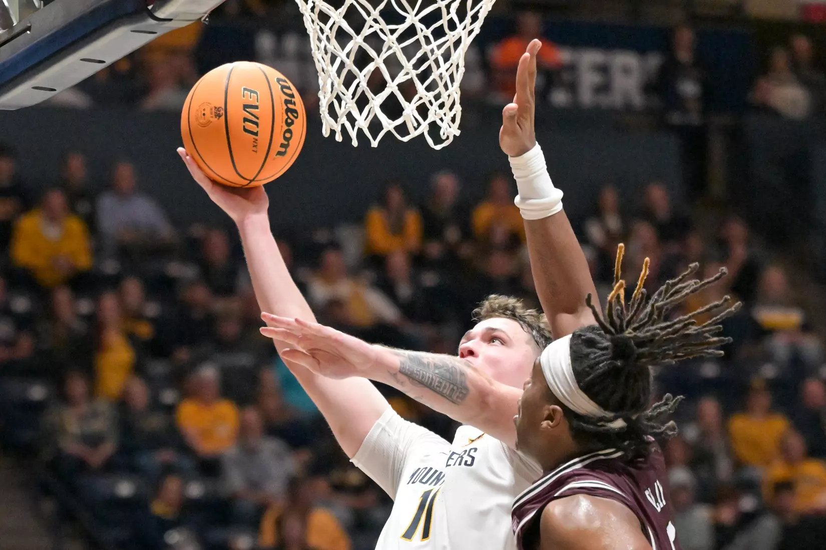 Quinn Slazinski lays in a bucket.
