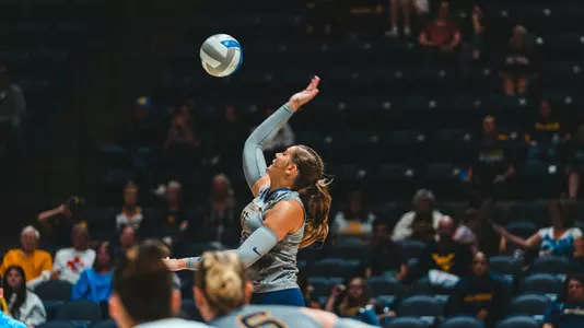 Melanie McGann serving