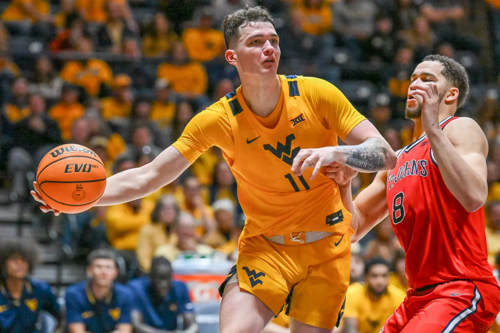 Quinn Slazinski passes in the paint.