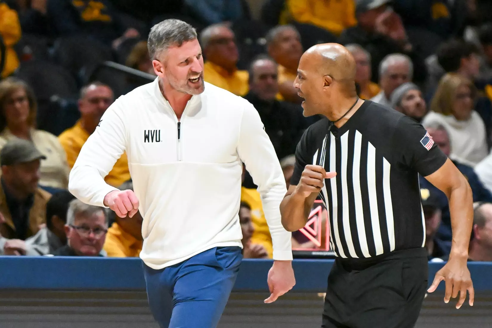 Head coach Josh Eilert talks to an official.