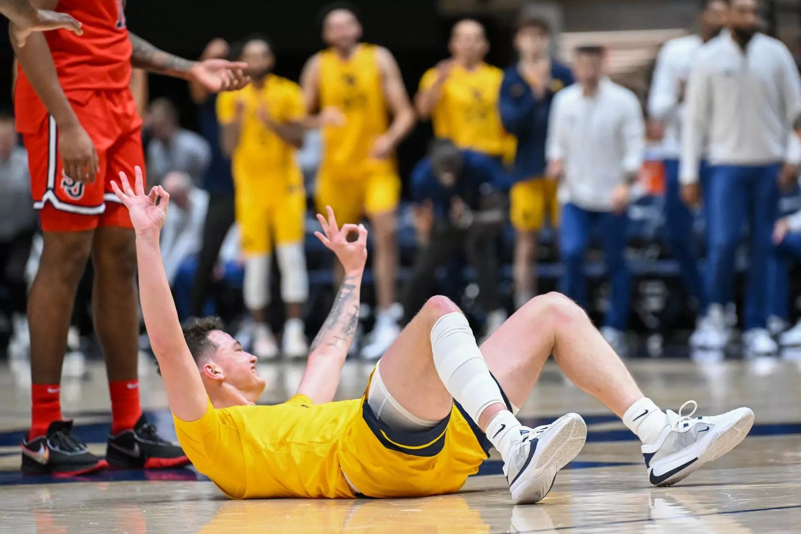 Quinn Slazinski celebrates a foul to shoot three.
