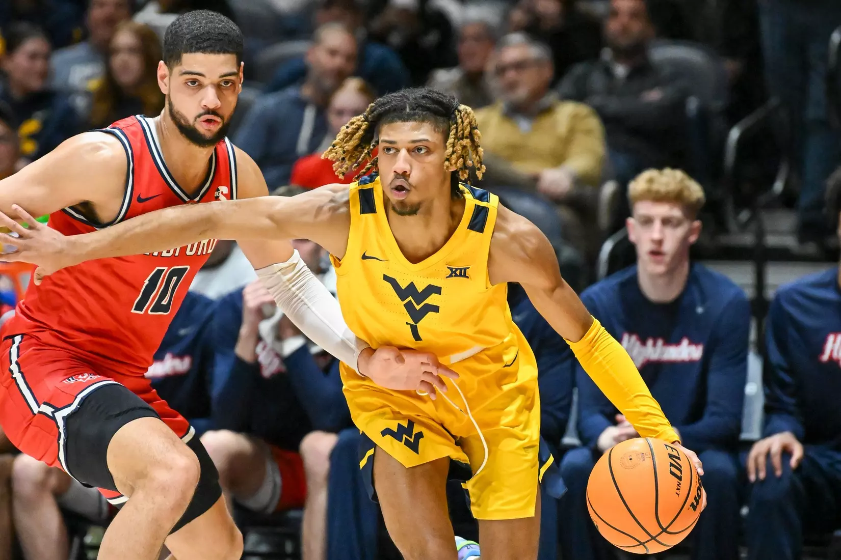 Noah Farrakhan drives around a defender.