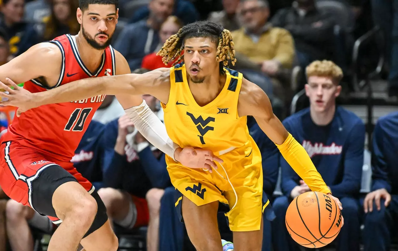 Noah Farrakhan drives around a defender.