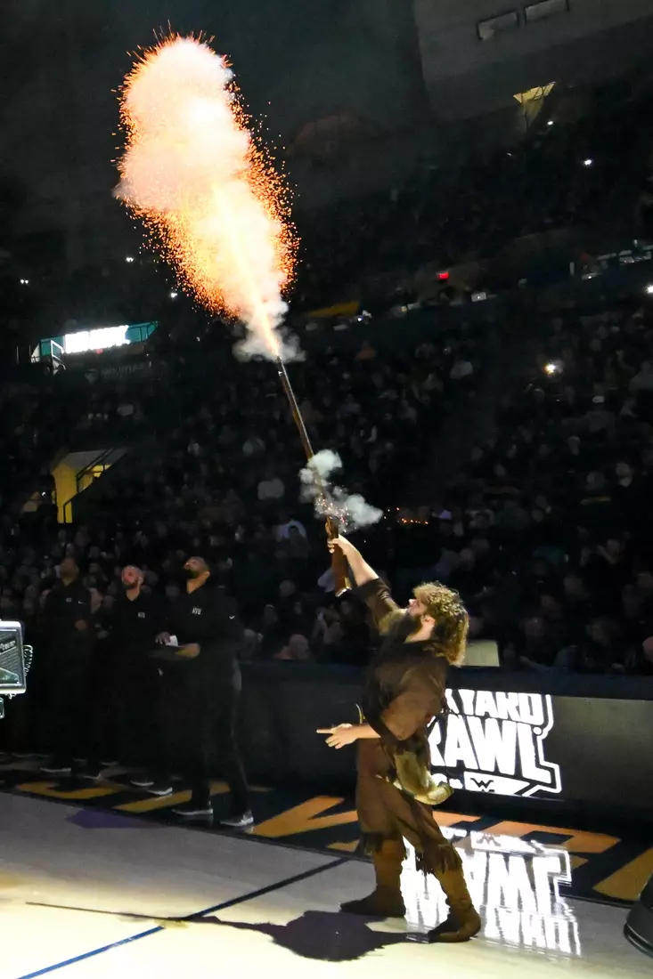 Mountaineer mascot Mikel Hager fires the musket.