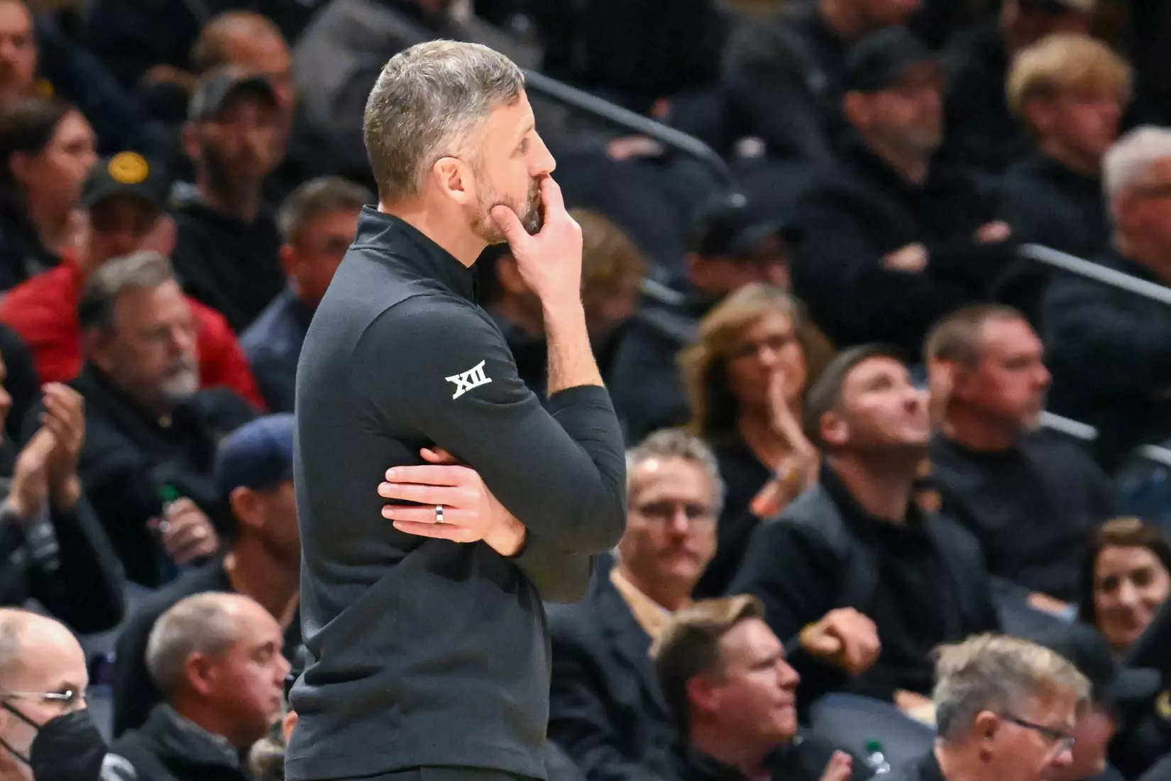 Josh Eilert watches from the sidelines.