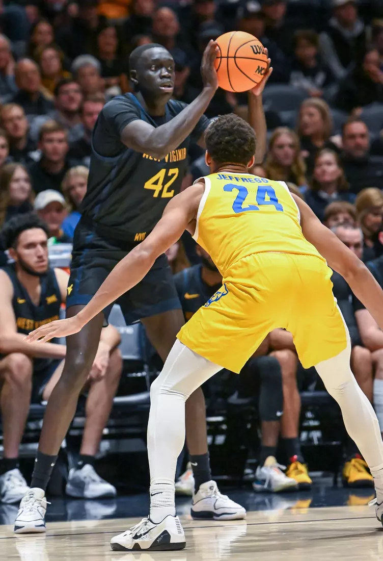 Akok Akok looks to pass.