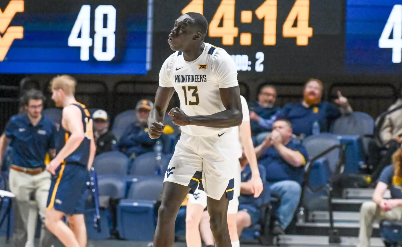 Akok Akok celebrates a blocked shot.