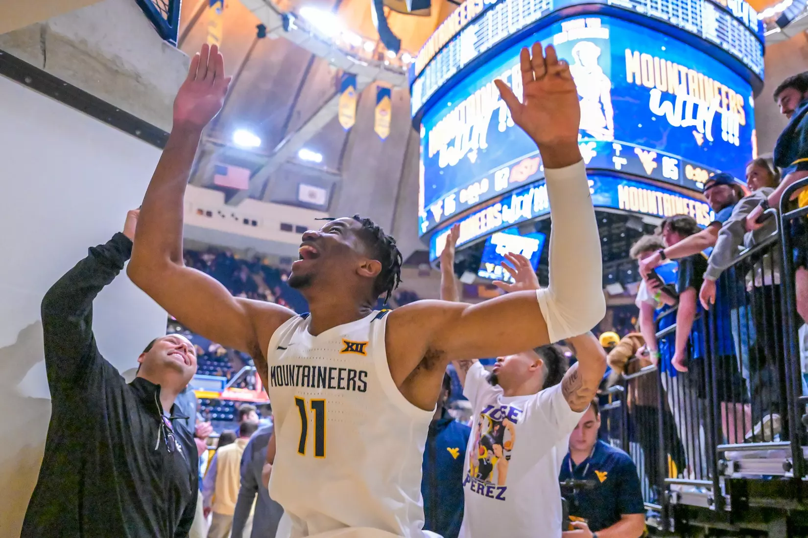 Mohamed Wague celebrates with the fans.