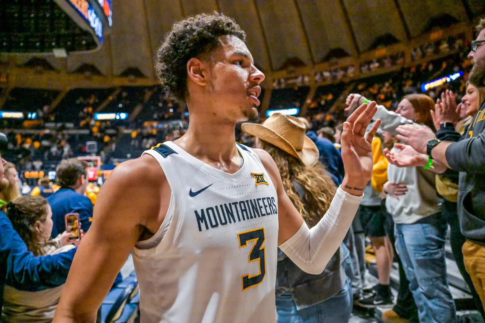 Tre Mitchell celebrates with the fans.