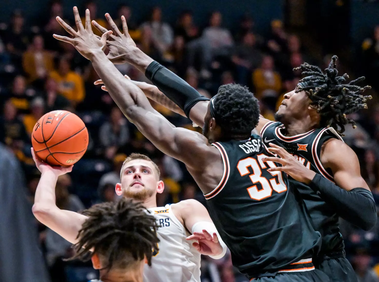 Erik Stevenson shoots over two defenders.