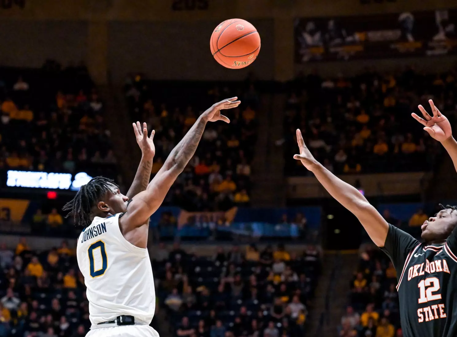 Kedrian Johnson scores a three.