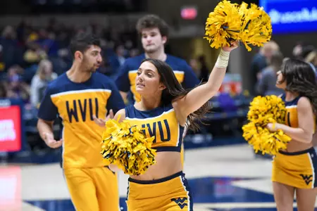 The cheerleaders cheer-on the Mountaineers.