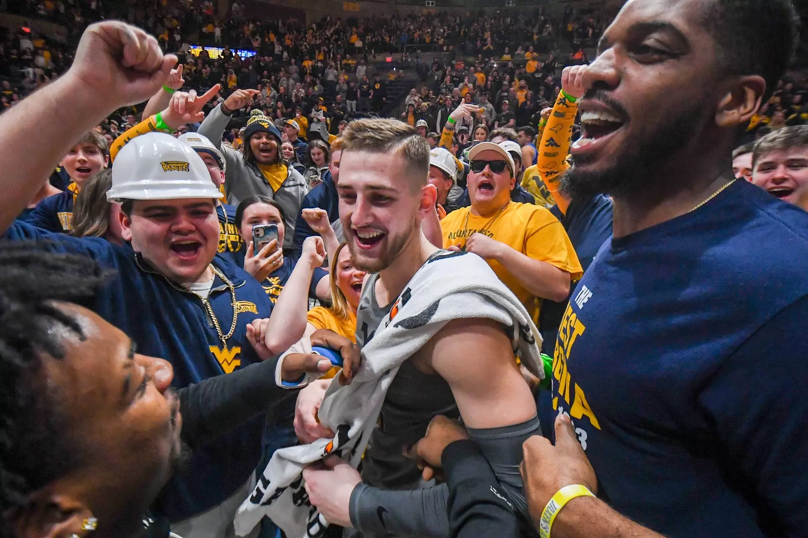 Erik Stevenson celebrates the win in the student section.