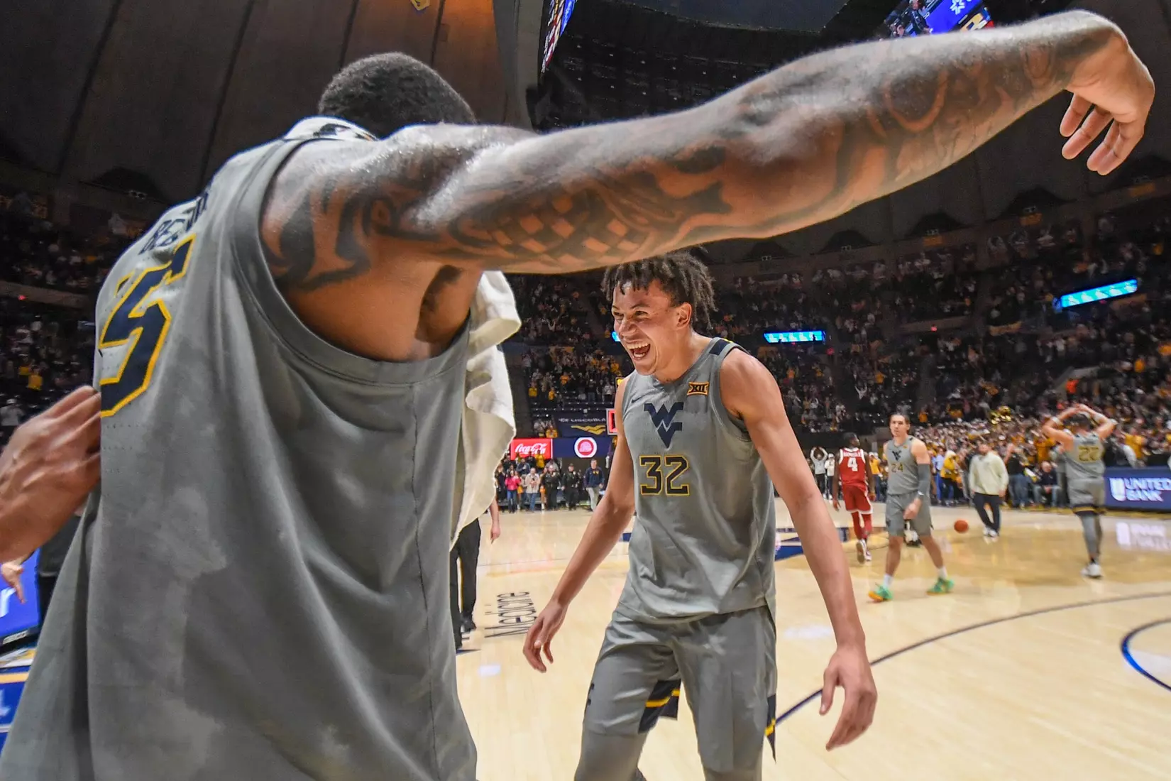 James Okonkwo is greeted by his teammates.