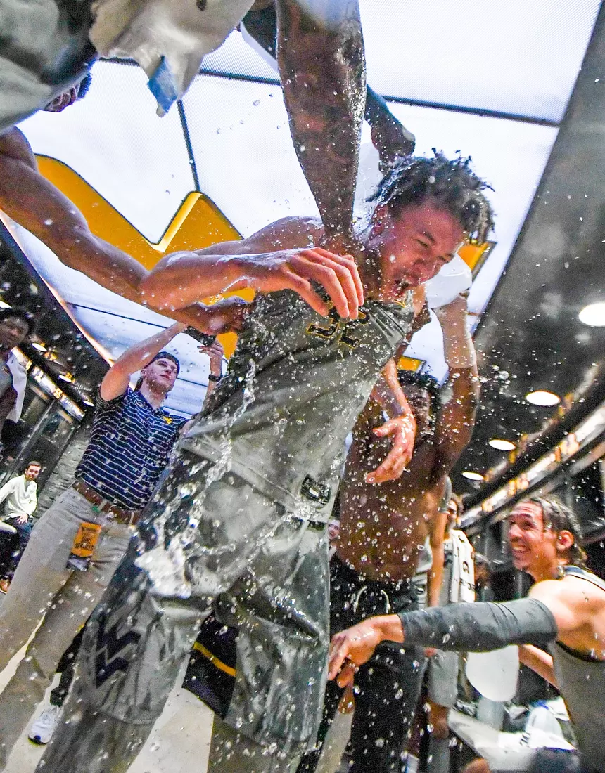 James Okonkwo gets a water shower from his teammates.
