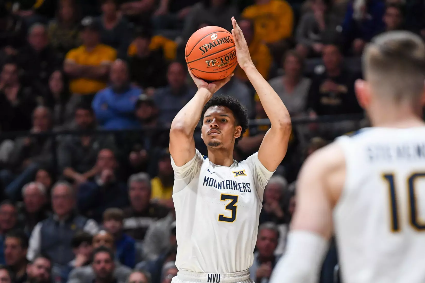 Tre Mitchell hits an early three-pointer.