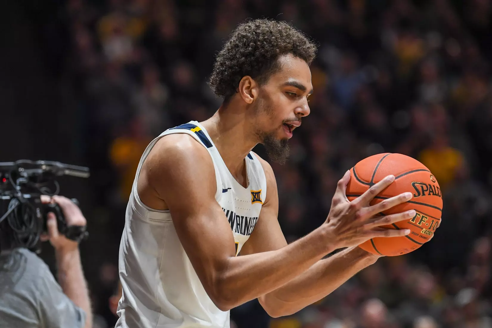 Emmitt Matthews thanks the ball for going out of bounds off two Iowa State players.