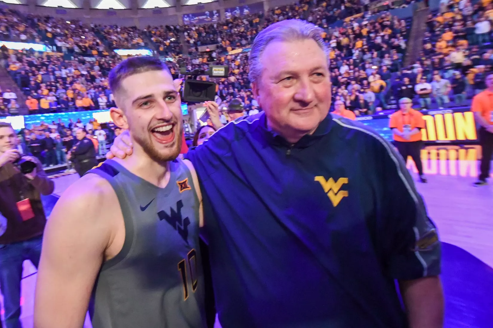 Erik Stevenson and Bob Huggins enjoy the win over Kansas St.