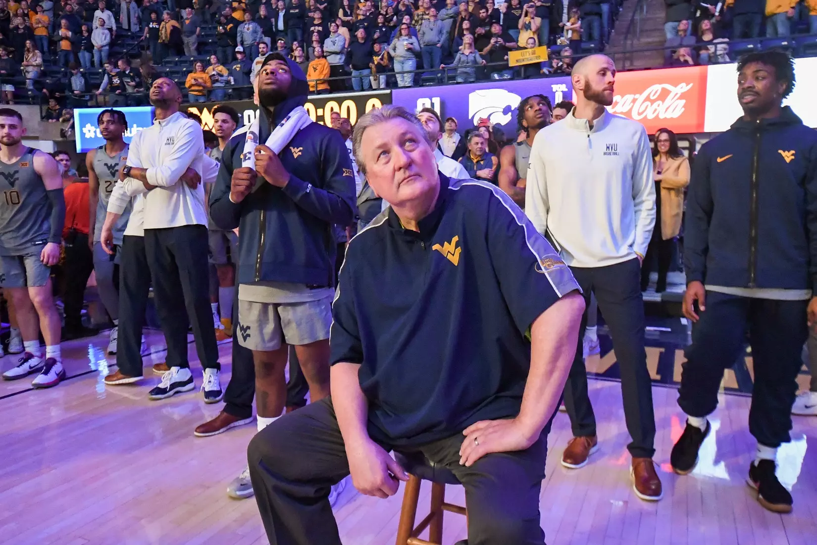 Head coach Bob Huggins watches the WVU Coliseum tribute video for 600 wins.
