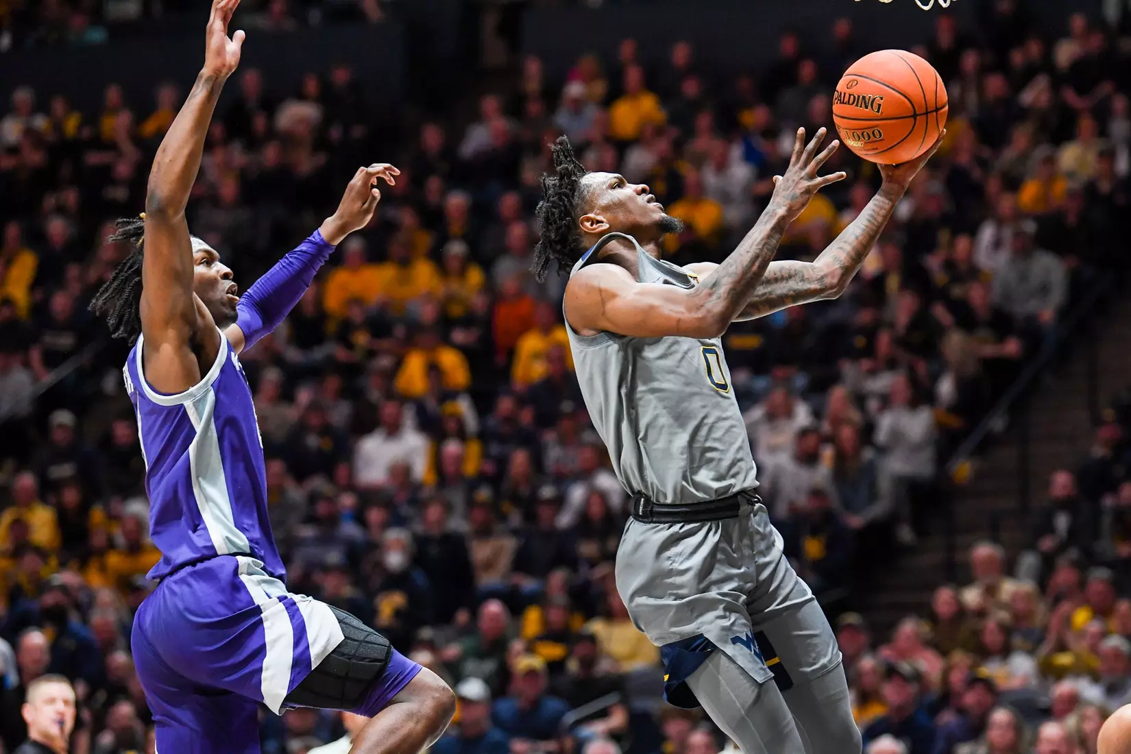 Kedrian Johnson scores on a layup.