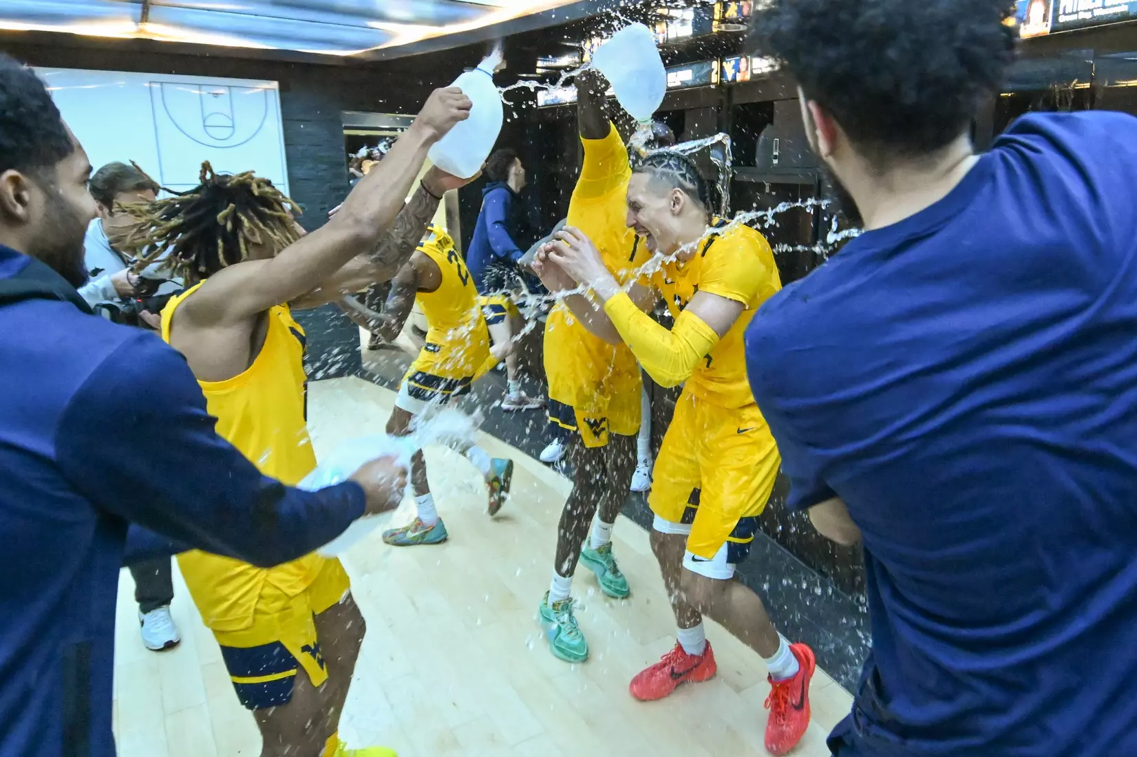 Patrick Suemnick gets the water-treatment in the locker room.