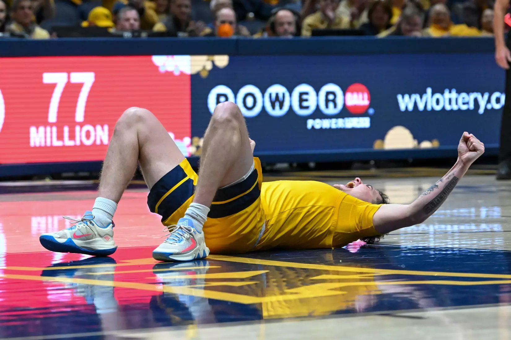 Quinn Slazinski celebrates a late foul while shooting.