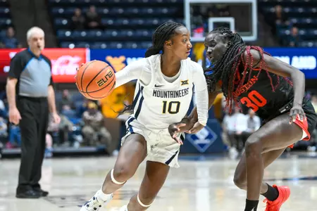 Jordan Harrison dribbles around a defender.