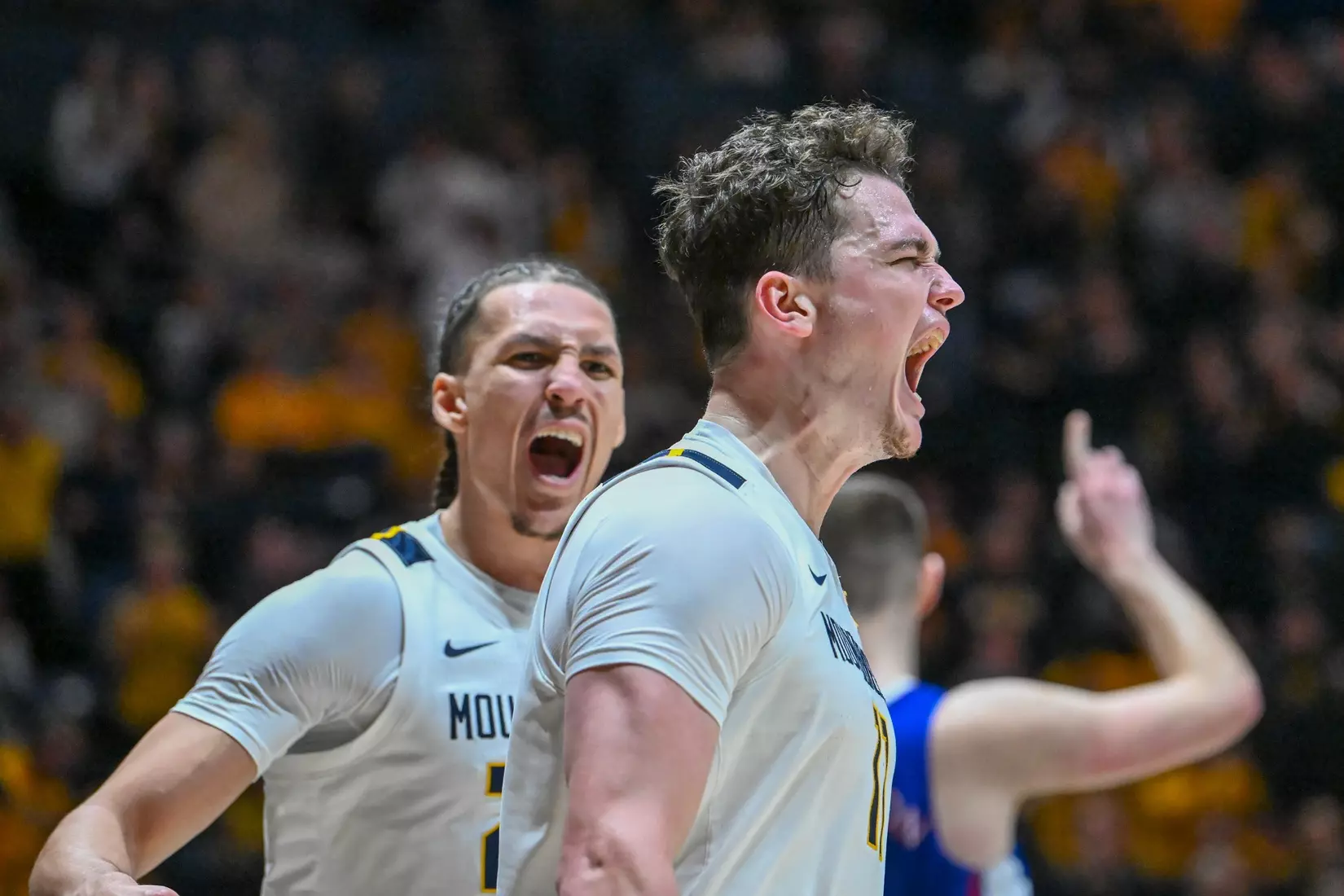 Quinn Slazinski and Patrick Suemnick celebrate a late foul call against Kansas.