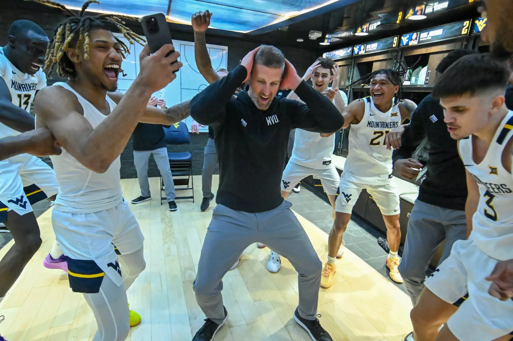 Josh Eilert and his Mountaineers celebrate the historic win over Kansas.
