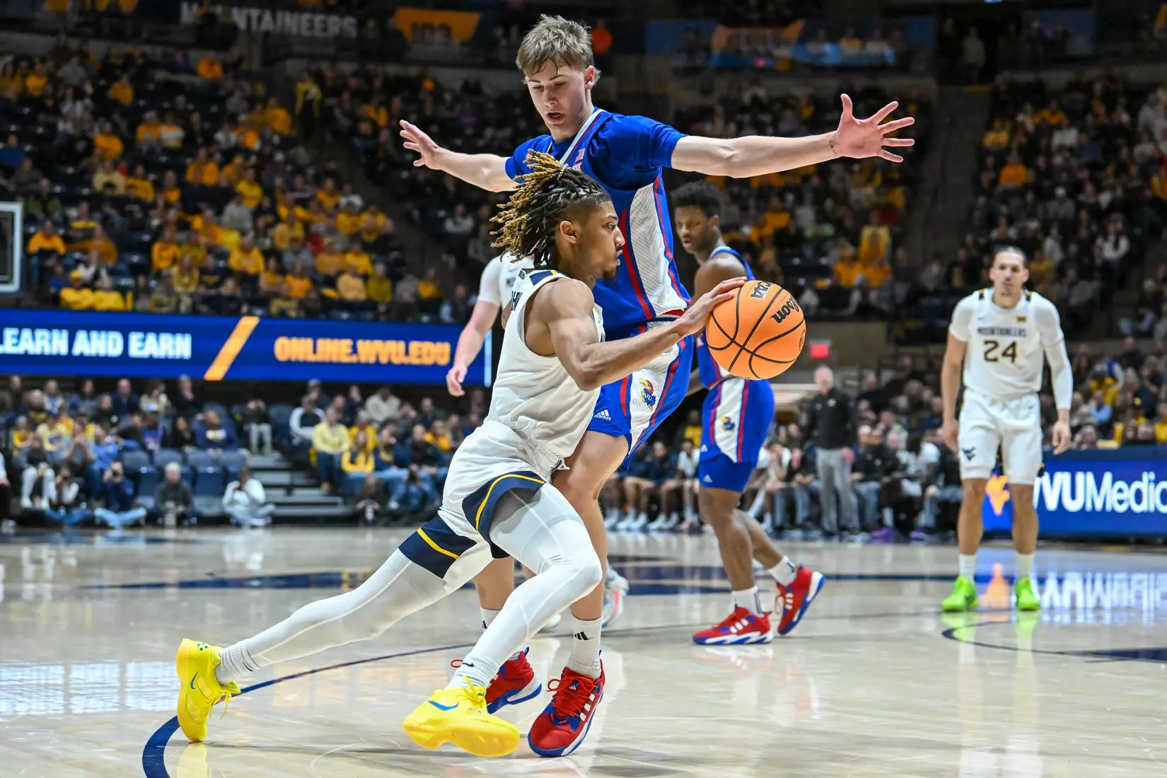 Noah Farrakhan is fouled while driving to the basket.