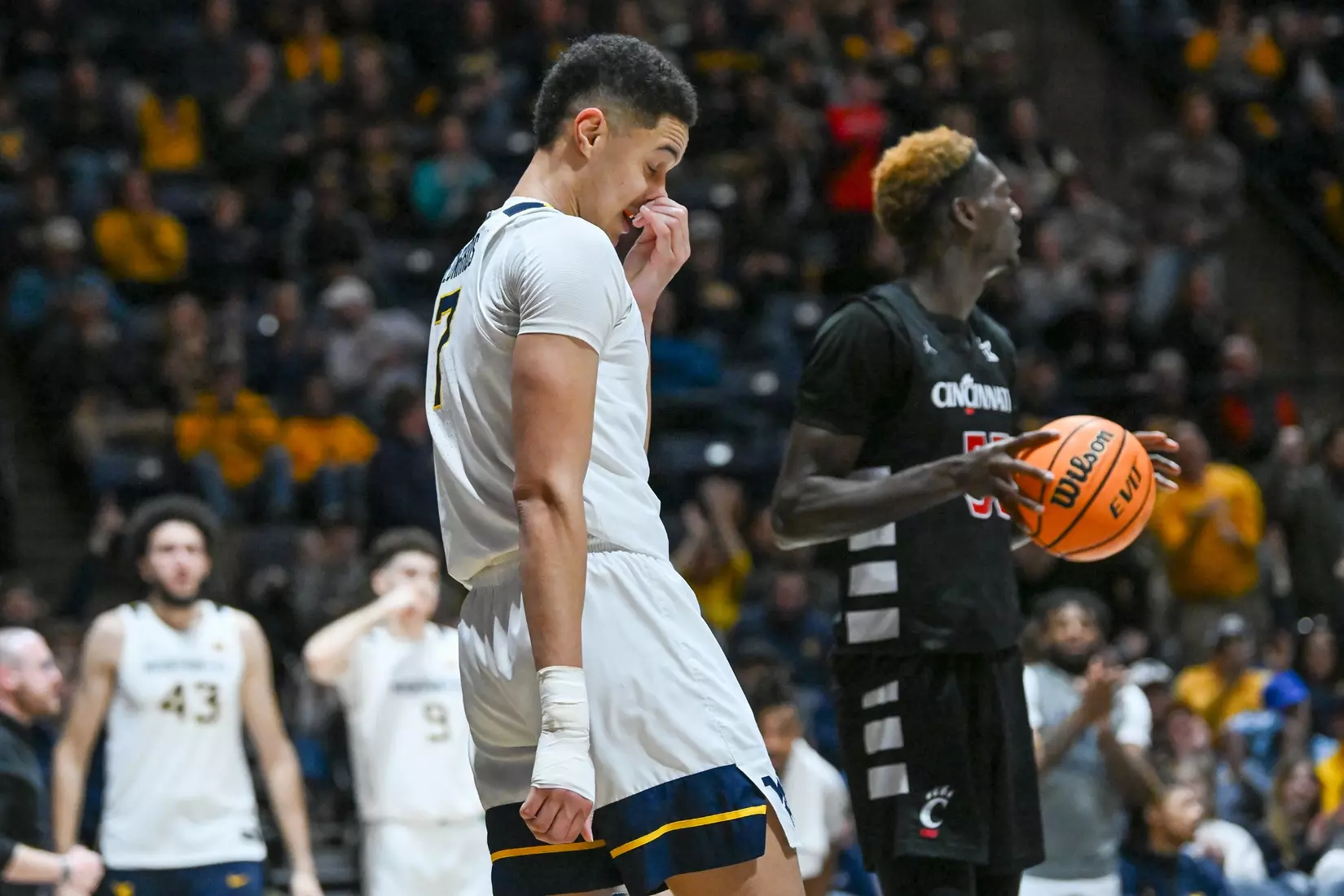 Jesse Edwards massages his nose after a heavy foul under the basket.