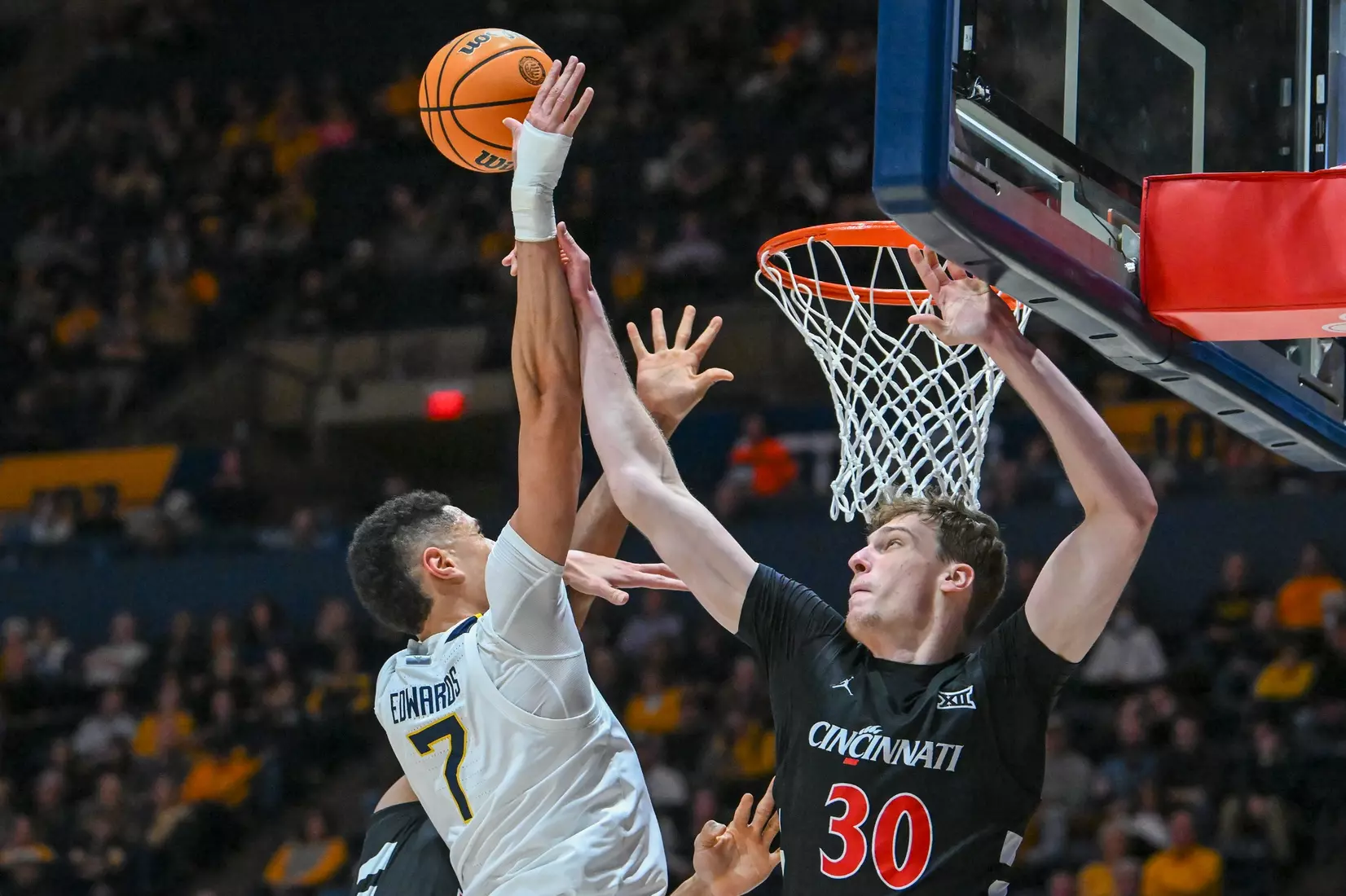 Jesse Edwards is fouled while shooting.