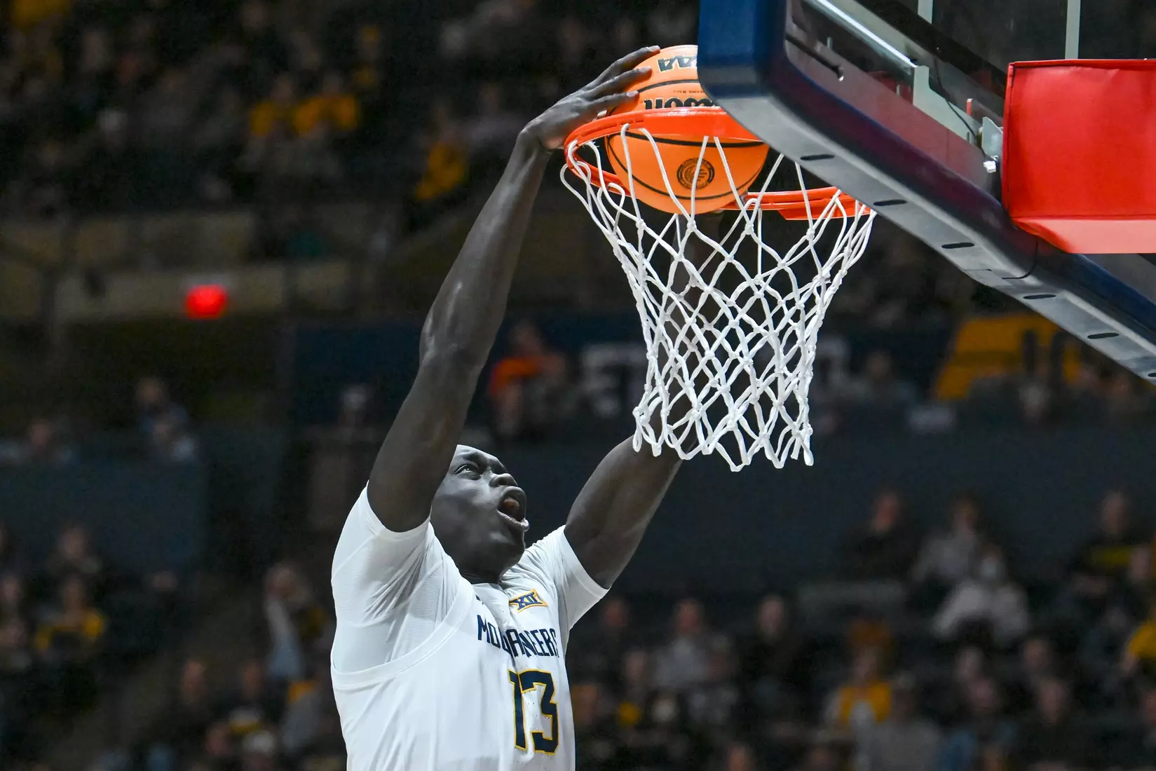 Akok Akok scores on a slam dunk.