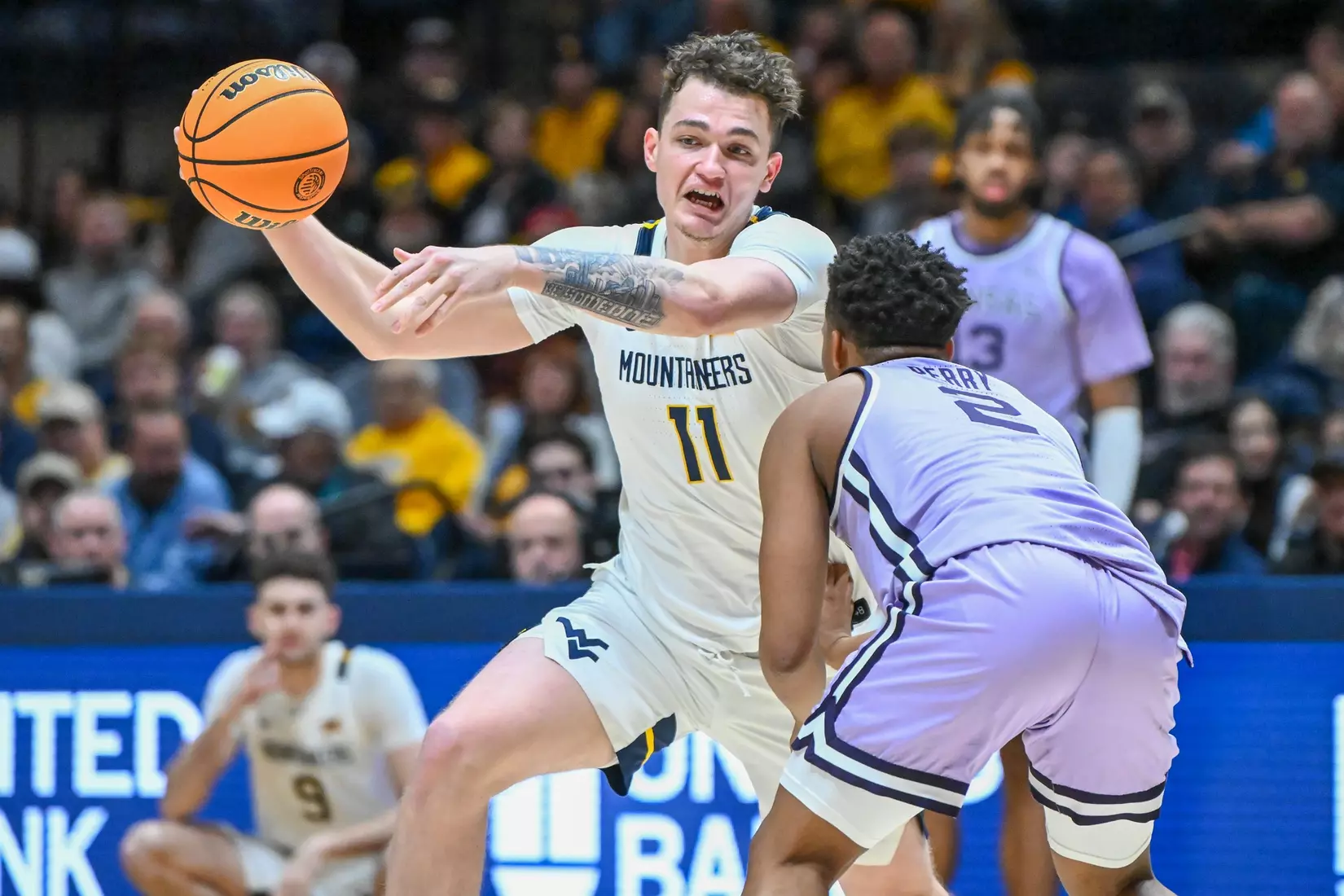 Quinn Slazinski drives to the hoop.