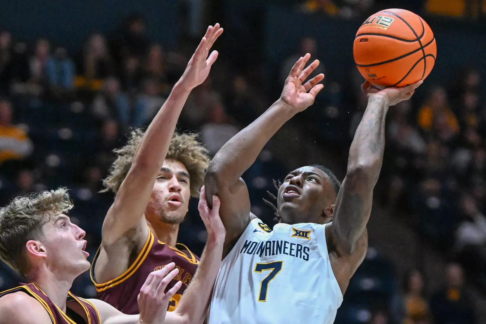 Game action of WVU vs University of Charleston Friday night at the WVU Coliseum.