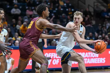Game action of WVU vs University of Charleston Friday night at the WVU Coliseum.