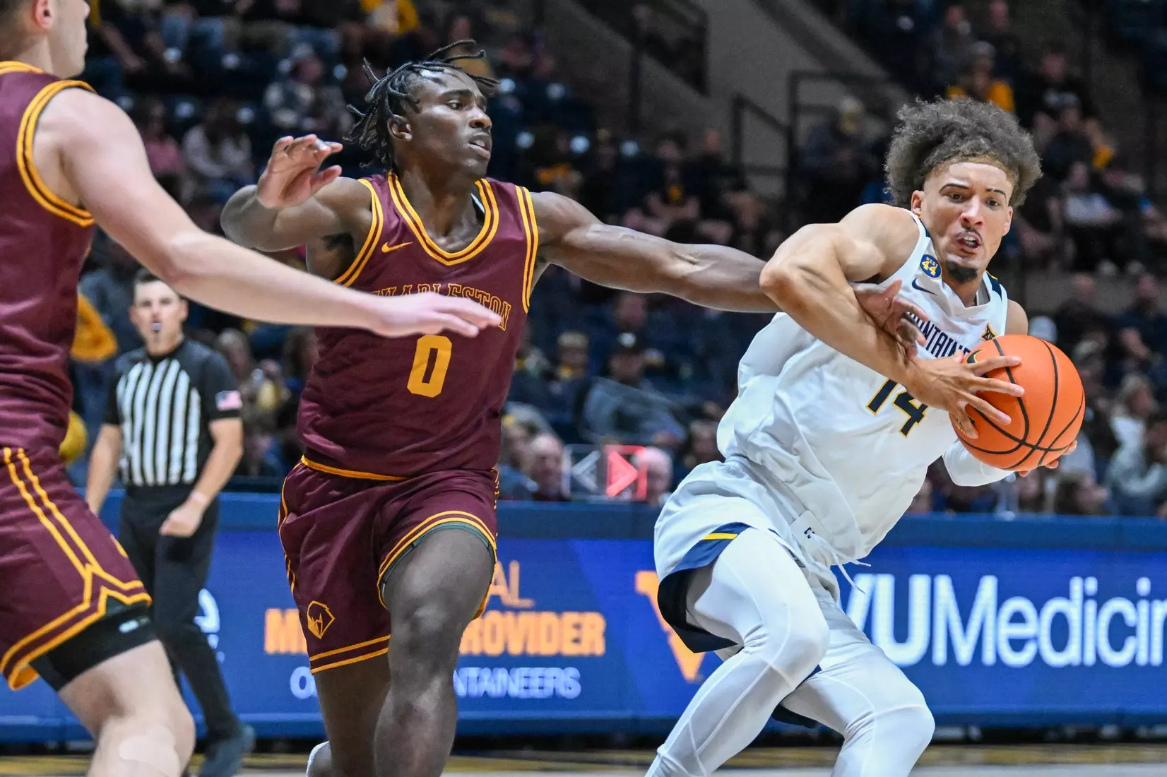 Game action of WVU vs University of Charleston Friday night at the WVU Coliseum.