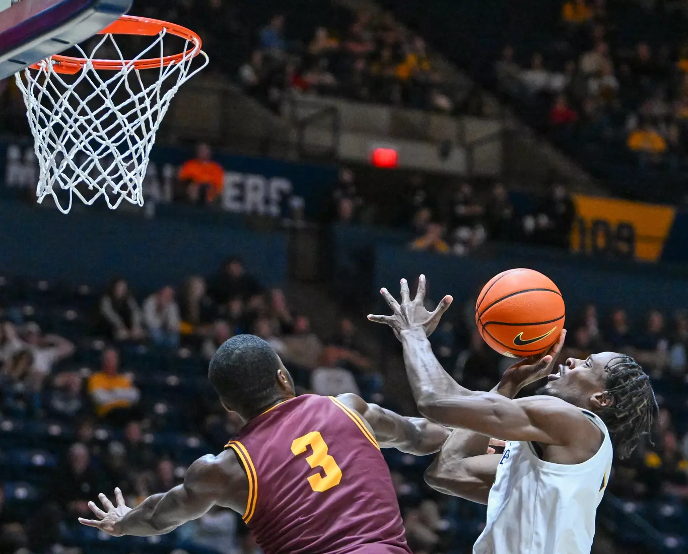 Game action of WVU vs University of Charleston Friday night at the WVU Coliseum.