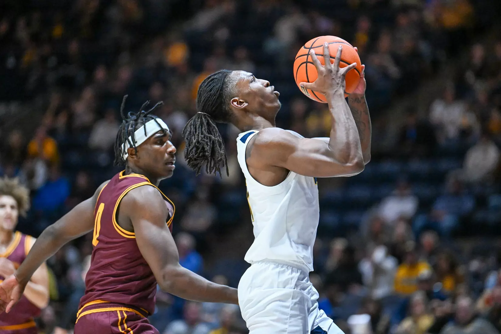 Game action of WVU vs University of Charleston Friday night at the WVU Coliseum.